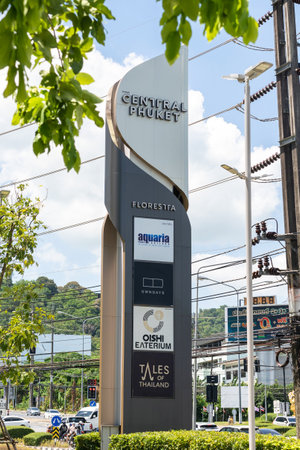 massive road sign stands by street, basking in bright sun raysのeditorial素材