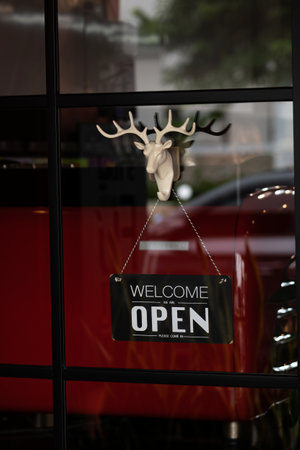 Talang Street, showcases sign saying Open on the doors of a cafeのeditorial素材