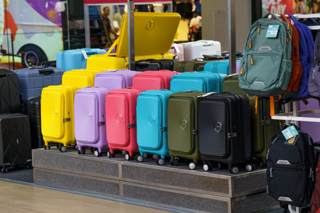 Variety of luggage and bags showcased alongside motor vehiclesのeditorial素材