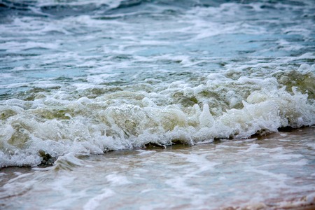 Strong waves crash over the beach at Sea of Azovの写真素材