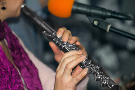 game on a musical instrument flute at event