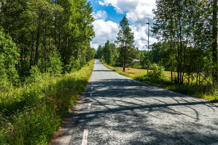 Sweden / Main road through the small Swedish village of Nordmark on a beautiful sunny dayの写真素材
