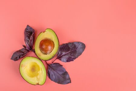 Avocado herb Basil on a pink background. Healthy food concept.の写真素材