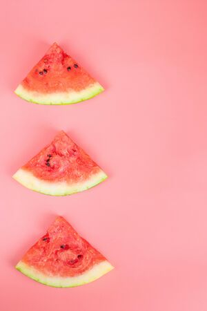 Watermelon slices on a pink background. Healthy food concept. Ripe juicy watermelon.の写真素材