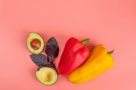 Avocado bell pepper herb Basil on a pink background. Healthy food concept.の写真素材
