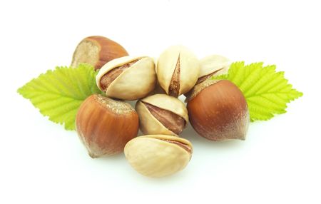 Wood nut and pistachios on white backgroundの写真素材