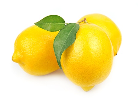 Lemon with leaves on whiteの写真素材