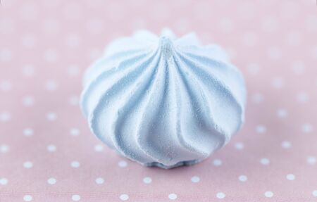 Blue marshmallows on a pink polka dot background. Sweet dessert.の写真素材