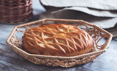 Fresh homemade open pie with cottage cheese and raisins. Traditional Russian yeast pastries, cheesecake, round buns, cottage cheese pie. Buns with cottage cheese and raisins.の写真素材