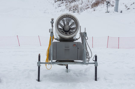 Snow cannon in the mountains. The landscape of the ski resort.の写真素材