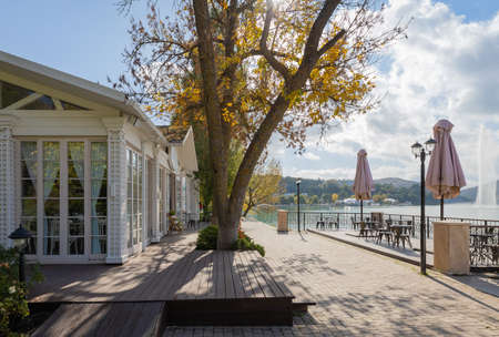 Russia. Abrau-Dyurso, May 7, 2021 A pleasant atmosphere of summer terraces and cafes in parks on the shore of the Abrau-Dyurso mountain lake.のeditorial素材