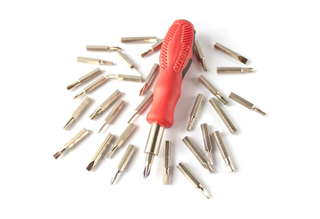 A set of bits for screwdrivers on a white background. A set of bits for repair and electronics.