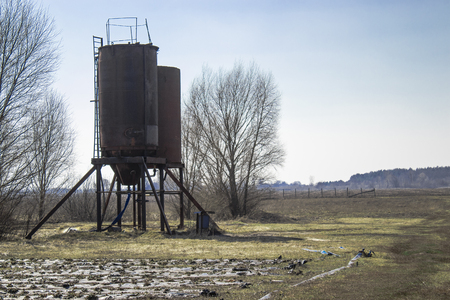 Iron towers for water on the field. Water storage tanks. Water storage in agriculture.の写真素材