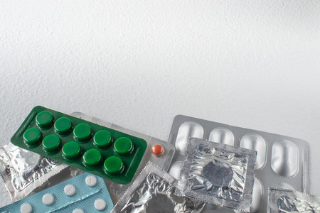 Different types of pills. Tablets in packs. Closed pills in pack close up.の写真素材
