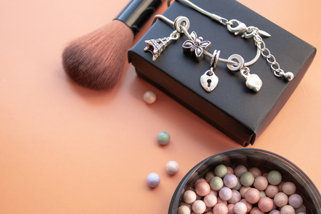 Cosmetic accessories. Brush, blush on a yellow background. With empty space on the left. View from aboveの写真素材