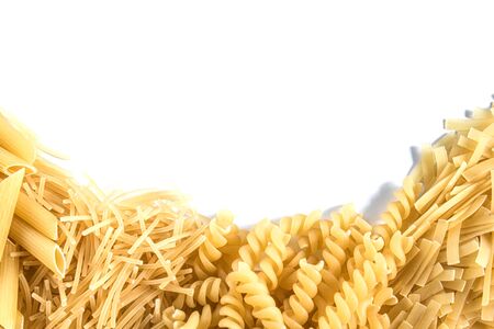 Different dry pasta and noodles on a white background. Free space for text. View from above.の写真素材