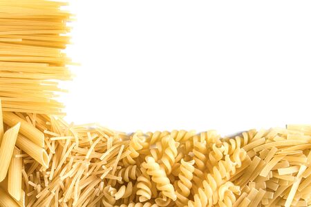 Different dry pasta and noodles on a white background. Free space for text. View from above.の写真素材