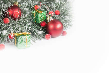 Red Christmas decorations with copy space on white background. Composition of Christmas holidays.の写真素材