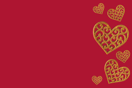 Heart of yellow color on a red background. View from above. Valentine's Day. Romance. Copy space on...