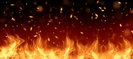 Fiery flame with sparks and fire texture on a black background. Firefighter explosion for background.の写真素材