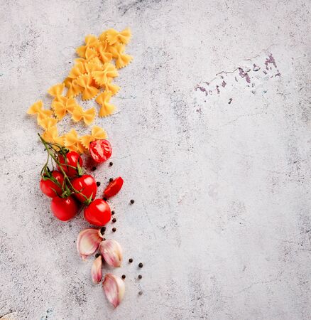 italian food. Ingredients for Pasta. spices on a gray grunge backgroundの写真素材