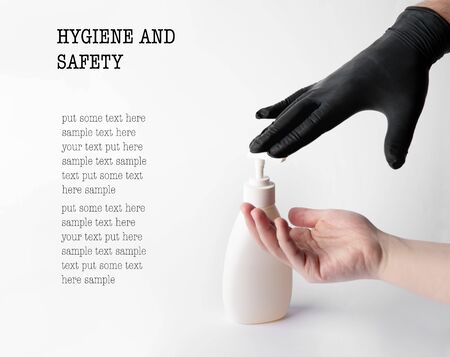 Someone gives a disinfectant gel to the hands of another personの写真素材