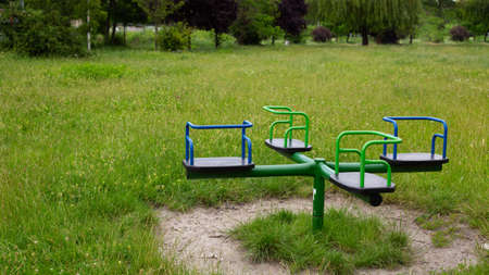 children's carousel on a grassed area. no people. High quality photoの写真素材