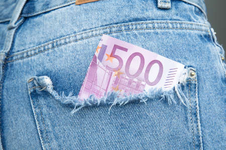 money in jeans pocket. five hundred euros in your pocketの写真素材
