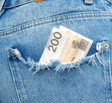 money in jeans pocket. two hundred zloty bill in a pocketの写真素材