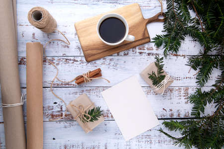 handmade gifts ,cup of coffee and card with pen on an old wooden tableの写真素材