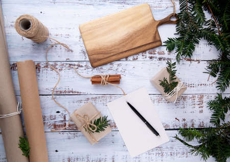 handmade gifts and card with pen on an old white wooden tableの写真素材