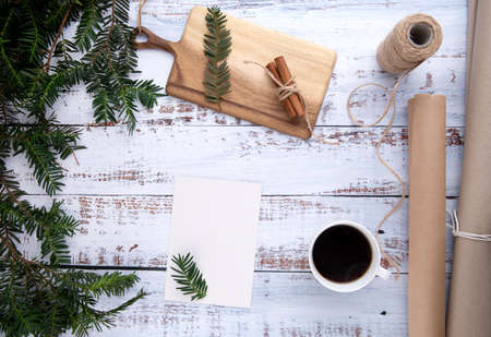 handmade gifts ,cup of coffee and card with pen on an old wooden tableの写真素材