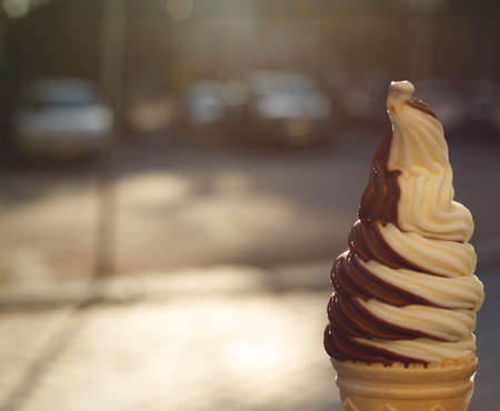 ice cream cone on the foreground close upの写真素材