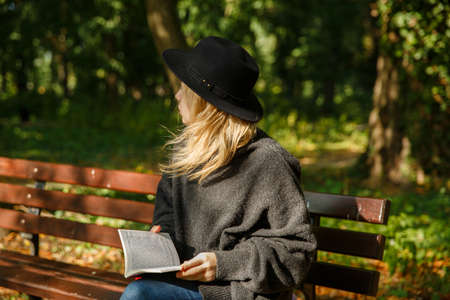girl in the park with a bookの写真素材