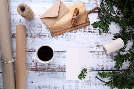 handmade gifts ,cup of coffee and card with pen on an old wooden tableの写真素材