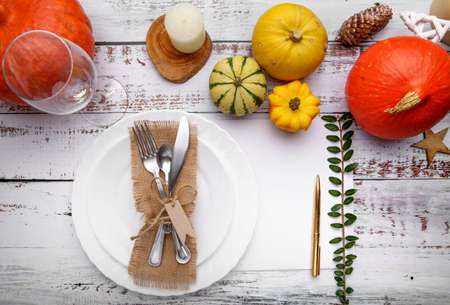autumn composition with cutlery plate and pumpkinsの写真素材
