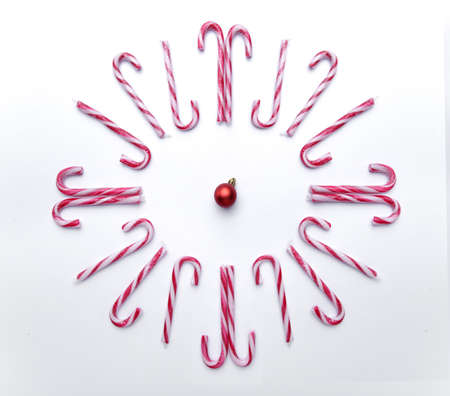 caramel canes laid in the form of a clockの写真素材