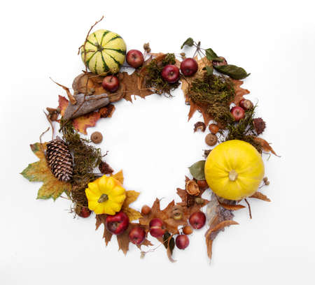 Autumn wreath frame made from yellow pumpkins and leavesの写真素材