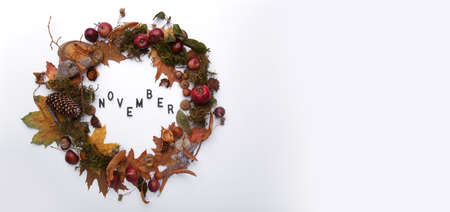Autumn wreath with inscription November on white backgroundの写真素材