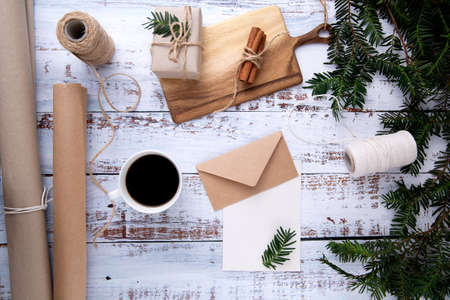 handmade gifts ,cup of coffee and card with pen on an old wooden tableの写真素材