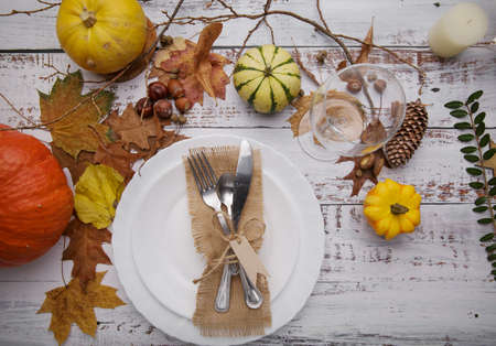 autumn composition with cutlery plate and pumpkinsの写真素材