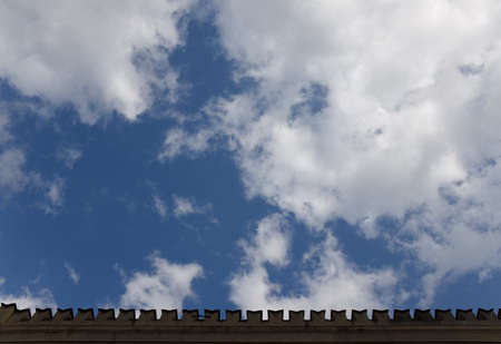 prongs on the facade of the building on the roof against the skyの写真素材