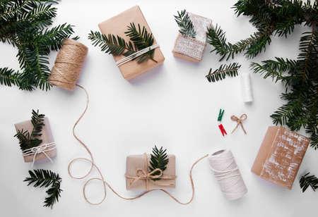 Christmas hand made gifts on a white background . Eco wrappingの写真素材