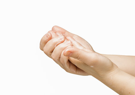 Female hands isolated on white, applying cream, massage. Health and beauty concept hand in hand. High quality photoの写真素材