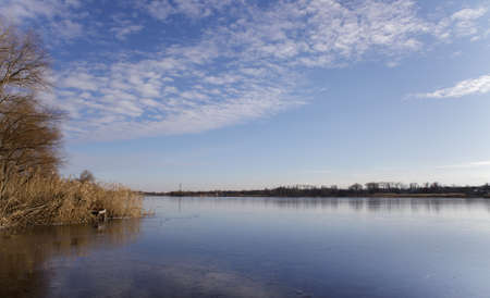 contrast panoramic photo of a winter frozen lake with a sunset. High quality photoの写真素材