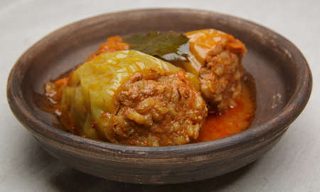 bell pepper stuffed with meat and rice in red tomato sauce on a plate. close-up. selective soft focus. healthy foodの写真素材