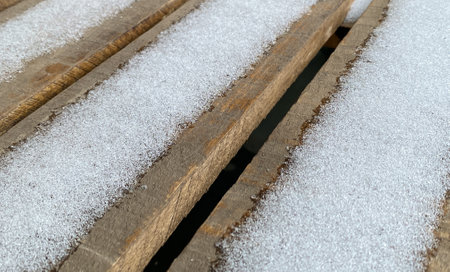snow lie on a wooden bench. close-up, nobody. High quality photoの写真素材