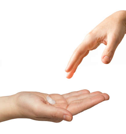cream in a slightly bent palm of a female Caucasian hand on a white background. hand reaches for hand. isolate. health and beauty concept. High quality photoの写真素材