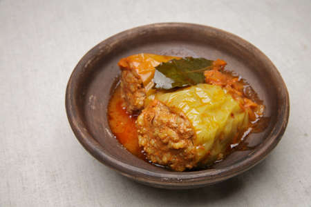 bell pepper stuffed with meat and rice in red tomato sauce on a plate. close-up. selective soft focus. healthy foodの写真素材