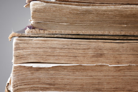 Detail of stack of old paperback books.vintage paper texture. selective soft focus. High quality photoの写真素材